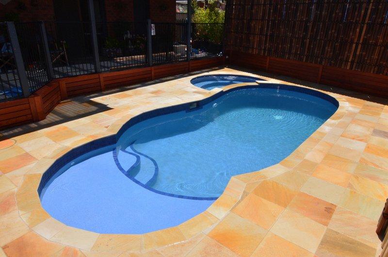 after-waterline-tiles-brick-coping-and-pebble-interior-2-bamboo-screening Pool Photos Before & After