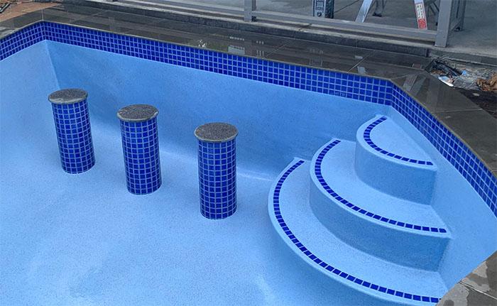 Bar Stools in a swimming pool renovation